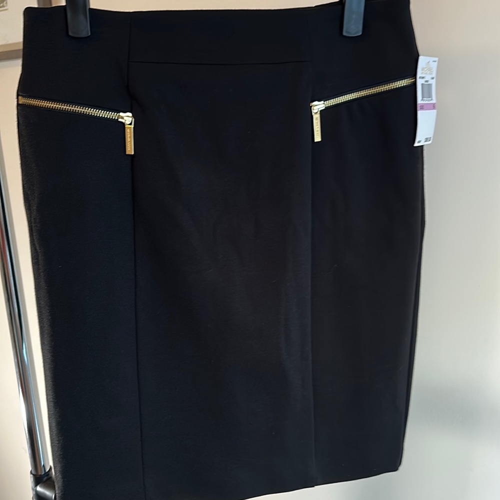 Black Michael Kors skirt. Size 6. NEW. Gold zippers. Zipper pockets, split